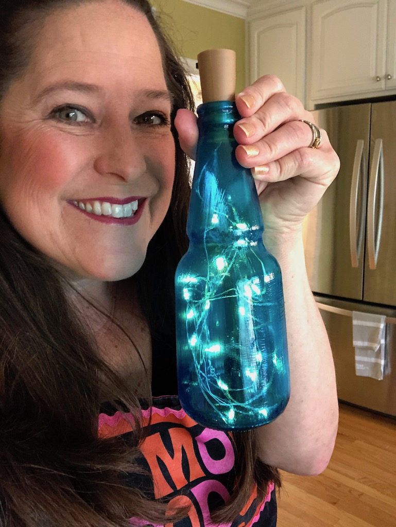 Light made using Happy Hauntings. Bottle colored using Modge Podge Glossy  and food coloring then baked. Outside of bot…