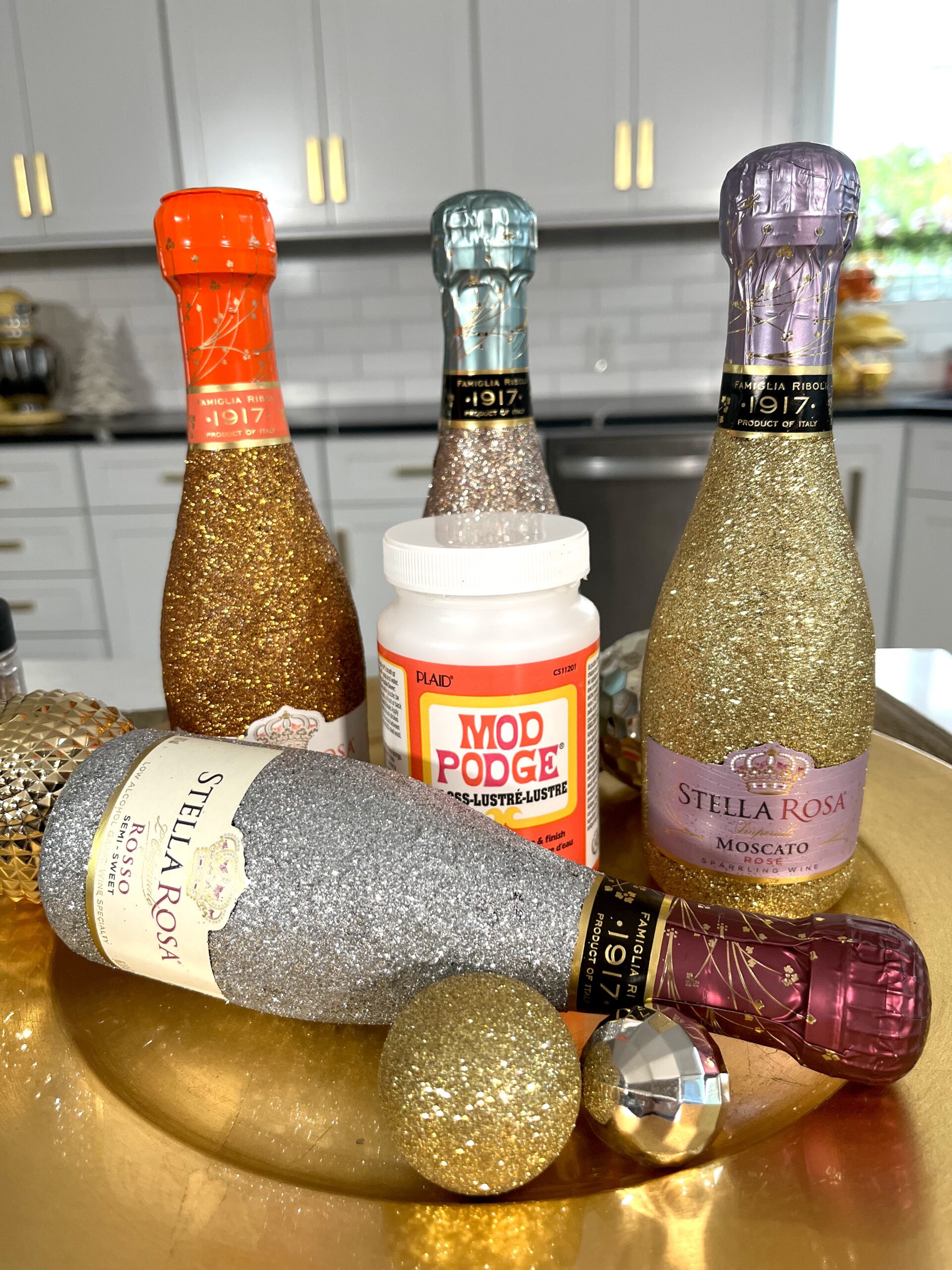 How to Glitter Wine Bottles with Mod Podge - CATHIE FILIAN's Handmade Happy  Hour